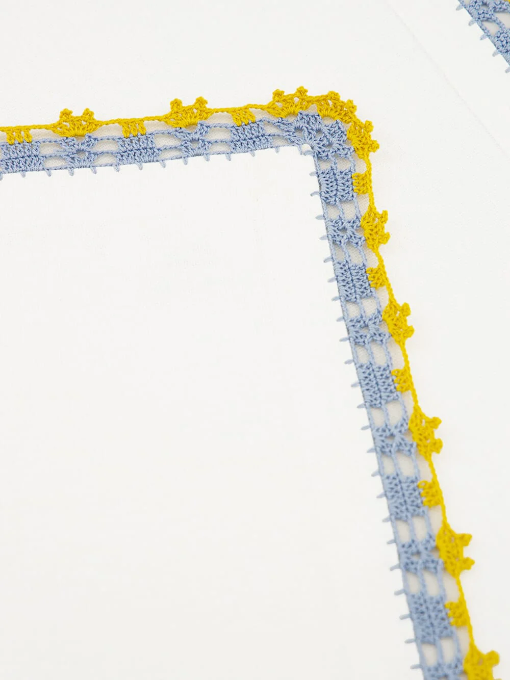 Hand-Embroidered Leonor Ecru Linen With Blue and Yellow Crochet Napkin - Image 3
