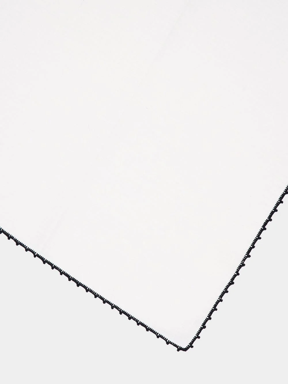 Hand-Embroidered Teresa White Linen with Black Crochet Napkin - Image 3