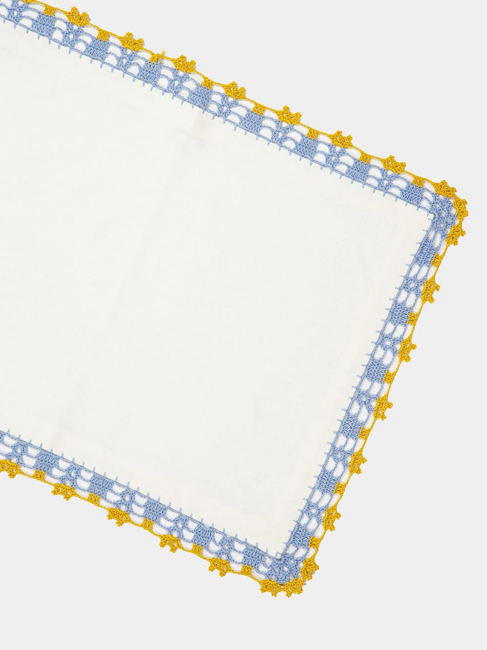 Hand-Embroidered Leonor White Linen With Blue and Yellow Crochet Placemat - Image 3